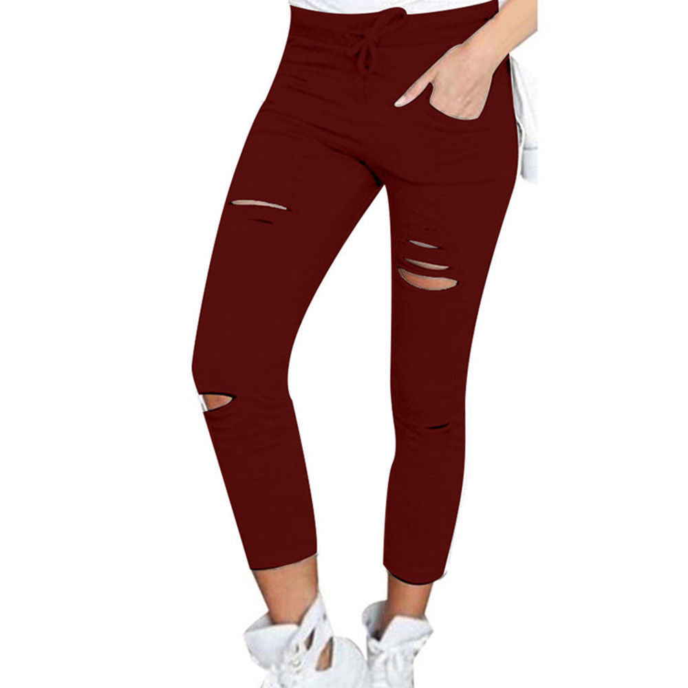 Fall Women's mid-length ripped pants.