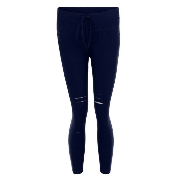 Fall Women's mid-length ripped pants.