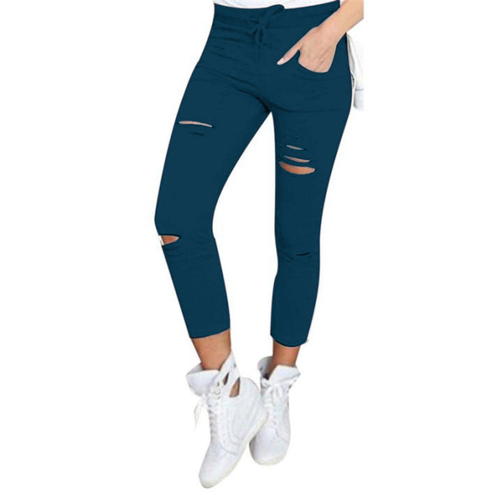 Fall Women's mid-length ripped pants.