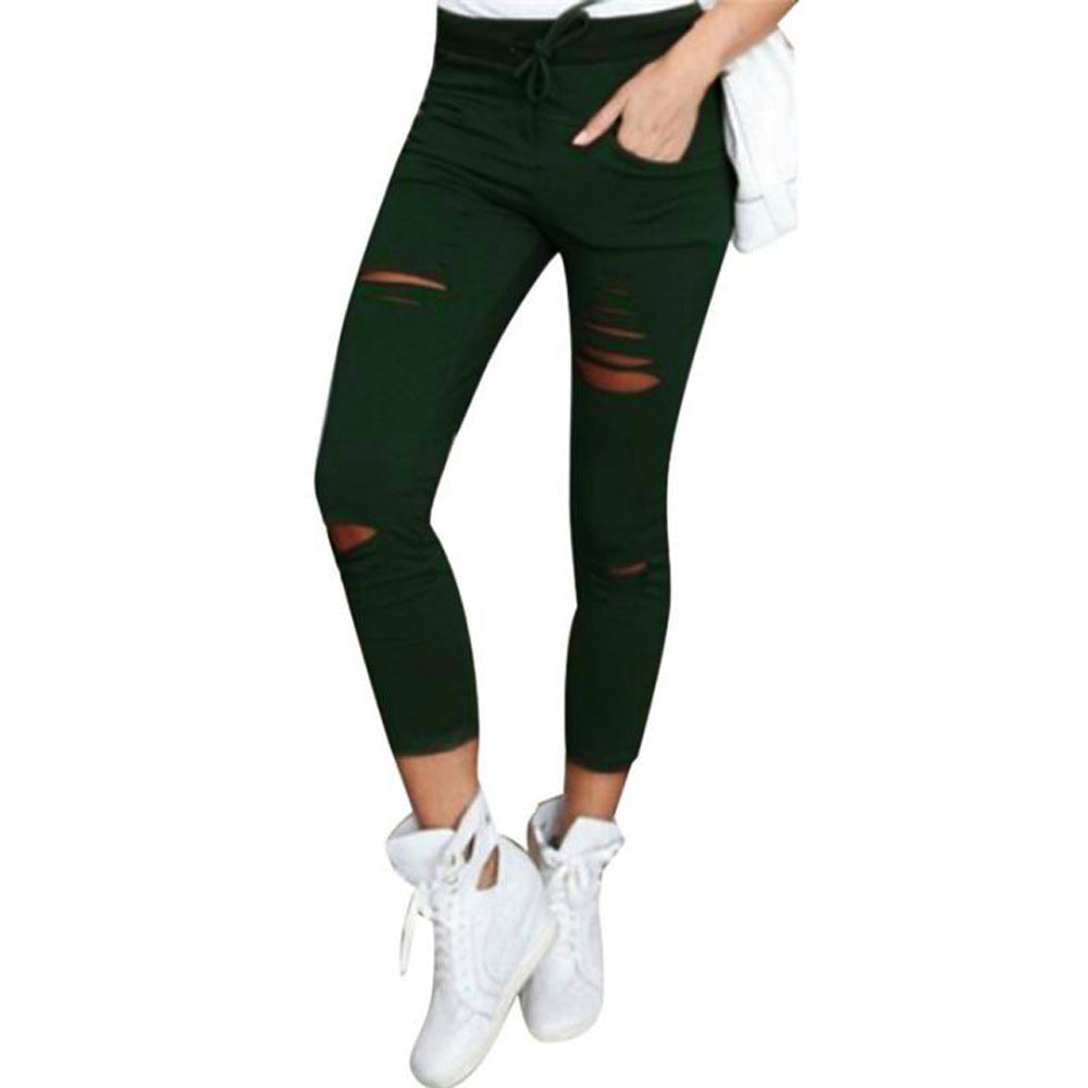 Fall Women's mid-length ripped pants.