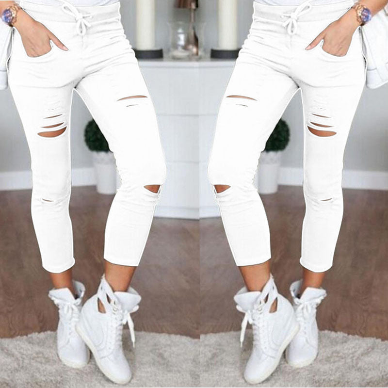 Fall Women's mid-length ripped pants.