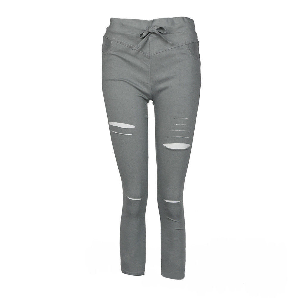 Fall Women's mid-length ripped pants.